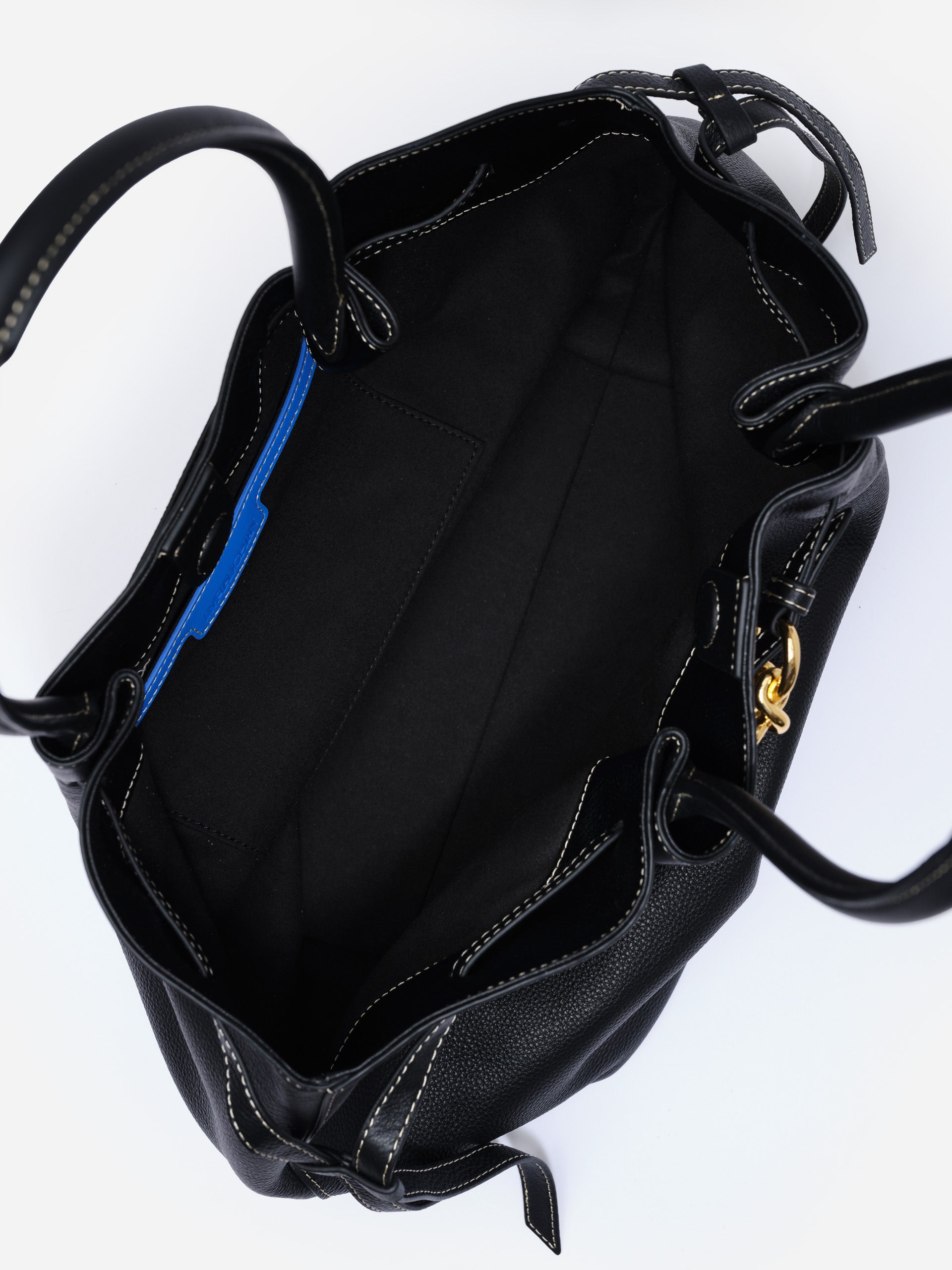 The Lex Leather Tote Bag by J.McLaughlin featuring a spacious black interior with multiple pockets, crafted with enduring designs and impeccable style.