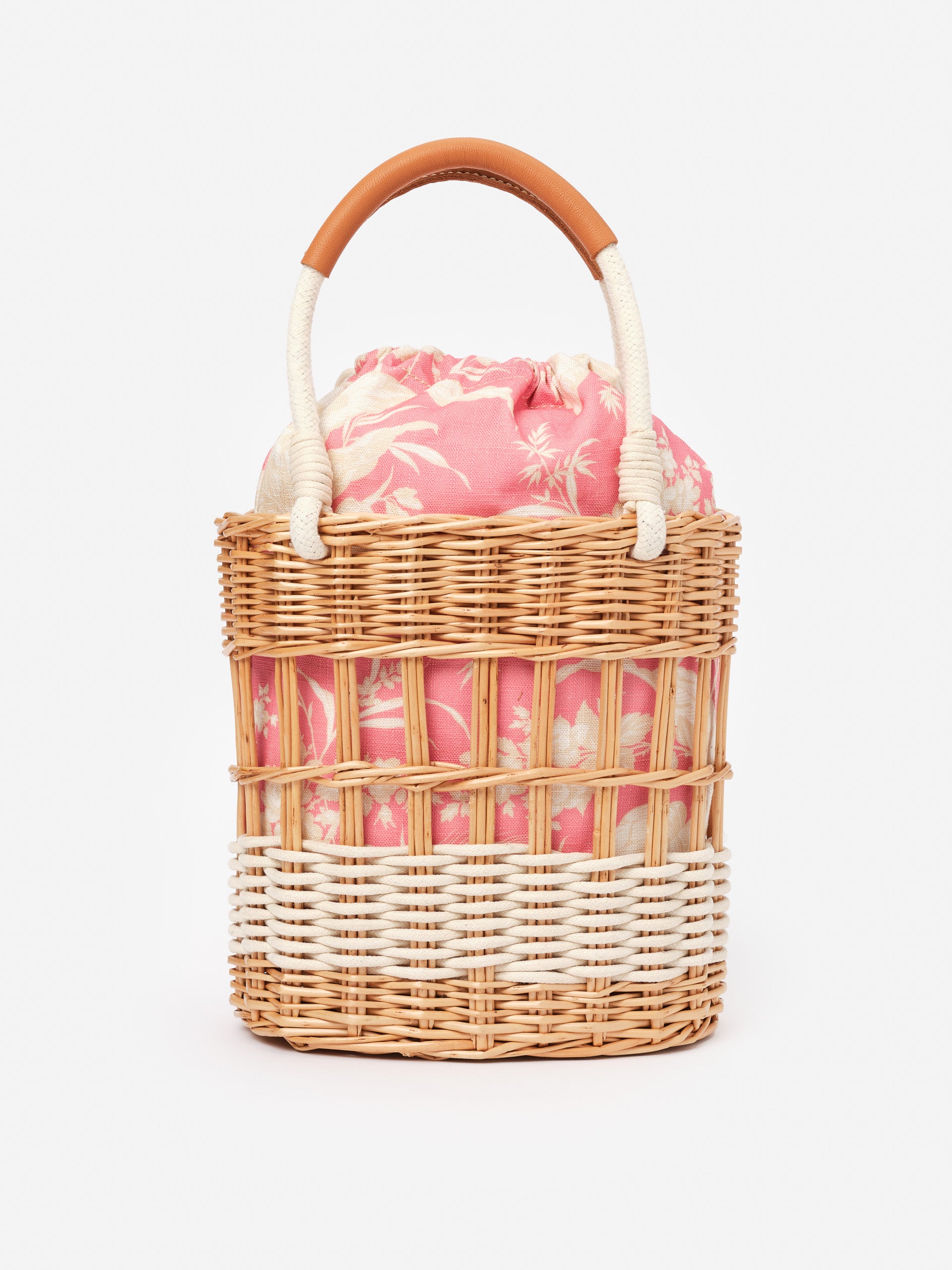 Caryl Wicker Handbag in Giardino Toile by J.McLaughlin, featuring an effortlessly stylish wicker design with a floral fabric interior, blending enduring designs and classic craftsmanship.