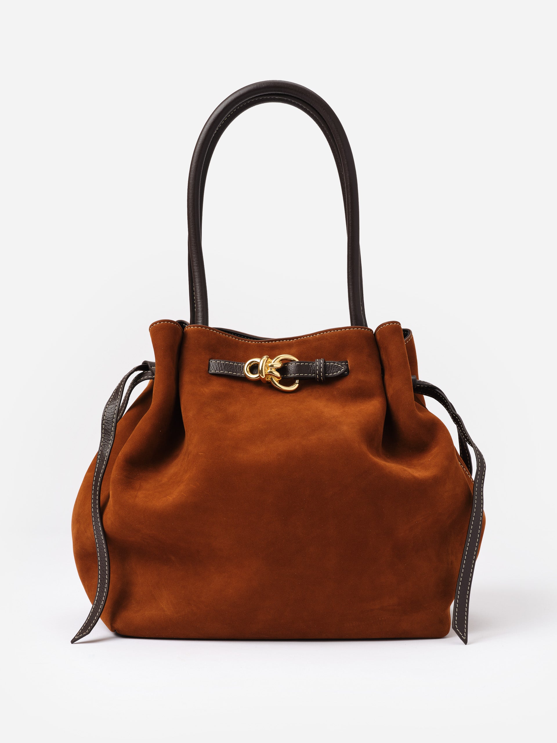 The Lex Suede Tote Bag by J.McLaughlin in rich brown suede with dark leather handles and gold hardware, showcasing effortlessly stylish and enduring design.