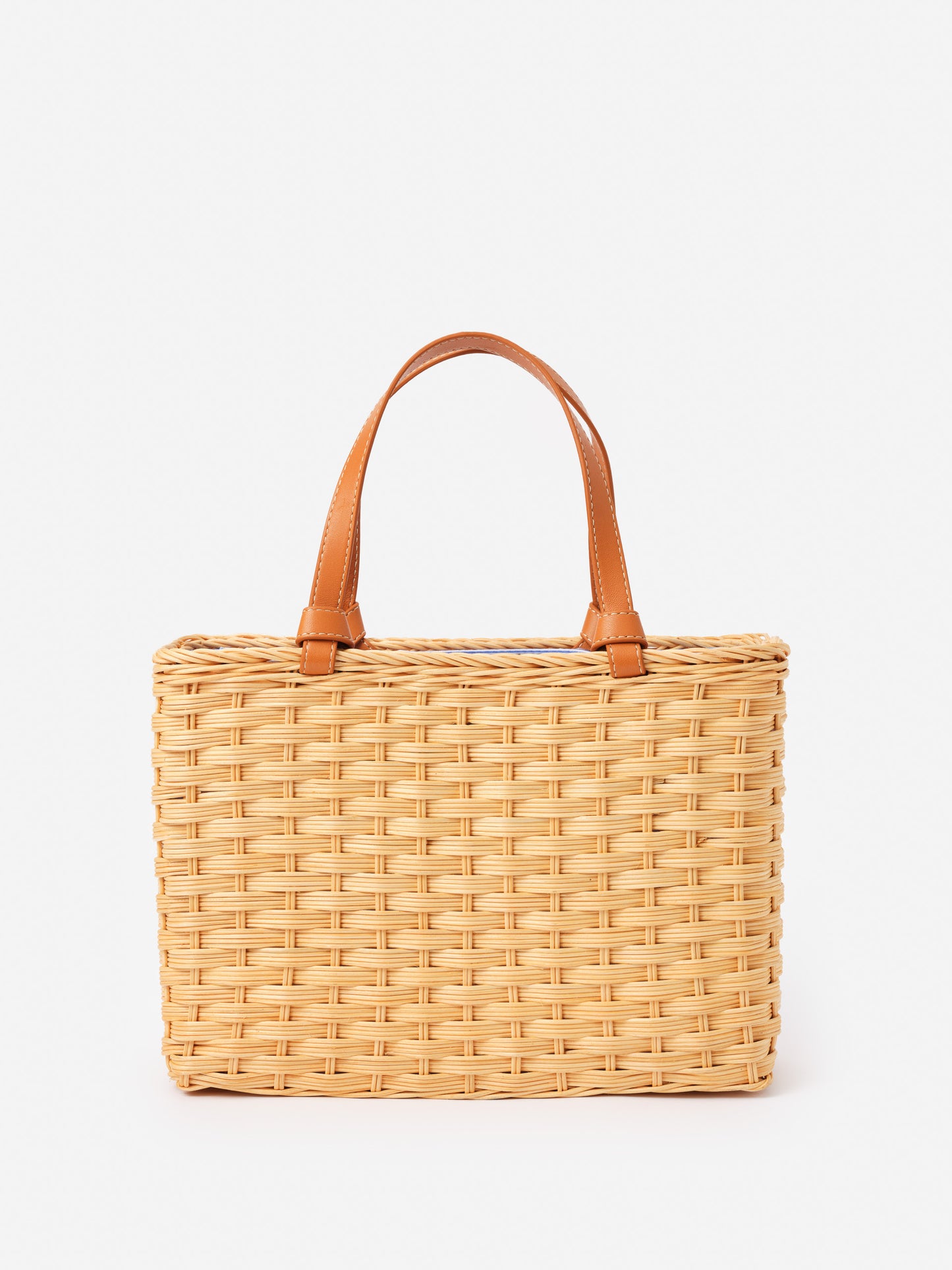 Caroline Wicker Handbag by J.McLaughlin features an effortlessly stylish woven wicker design with leather handles, blending enduring designs and innovative fabrics for a timeless accessory.