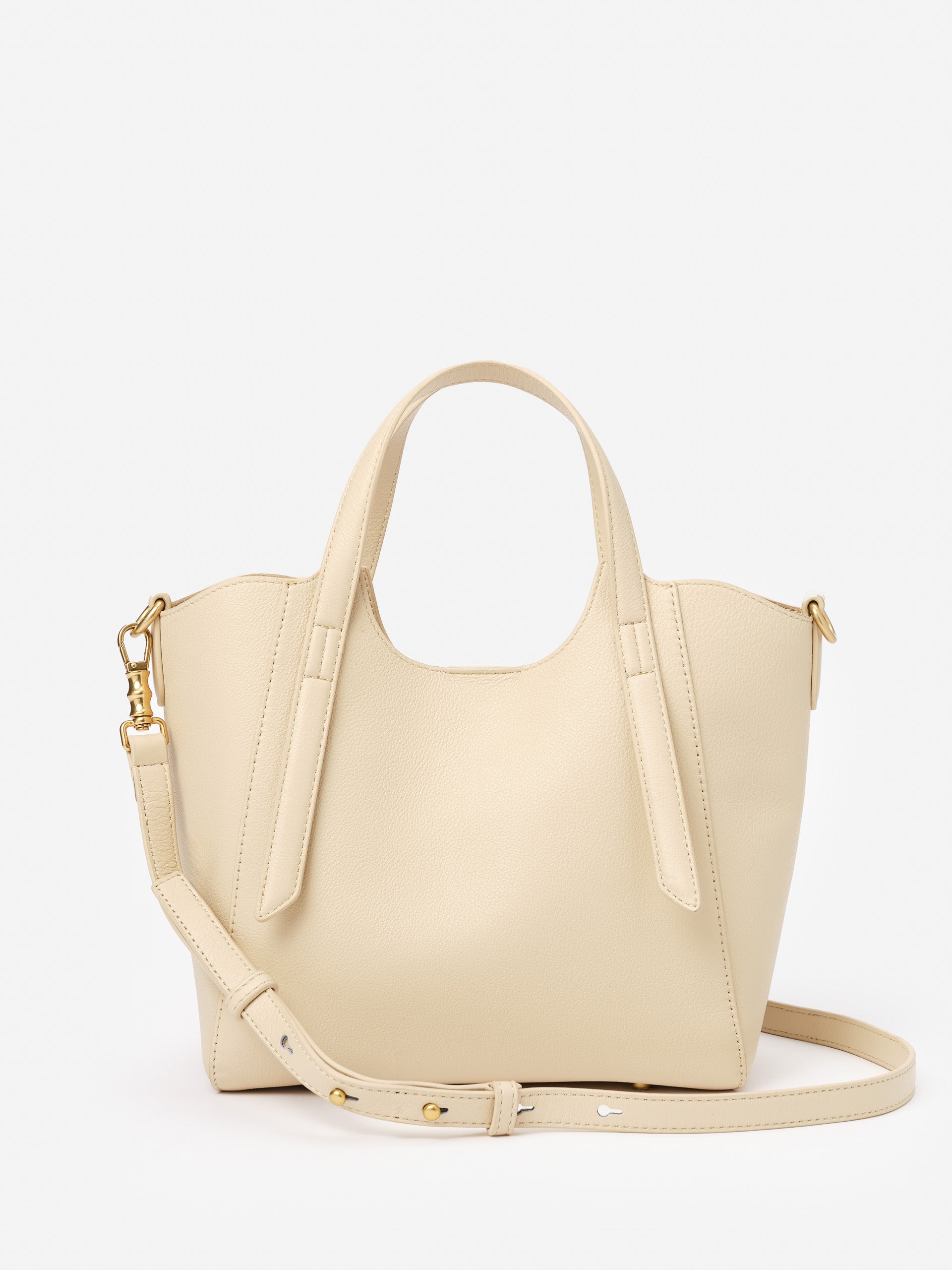 Lane Leather Mini Tote in soft beige leather by J.McLaughlin, featuring effortless style and enduring design with a detachable strap, embodying timeless fashion.