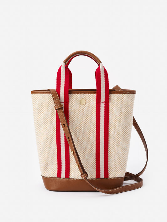 Emery Canvas Mini Tote by J.McLaughlin features a durable canvas body with bold red and white striped handles, complemented by leather trim, embodying effortlessly stylish, enduring designs in bags. A destination for defining style. Life, Well-Lived.