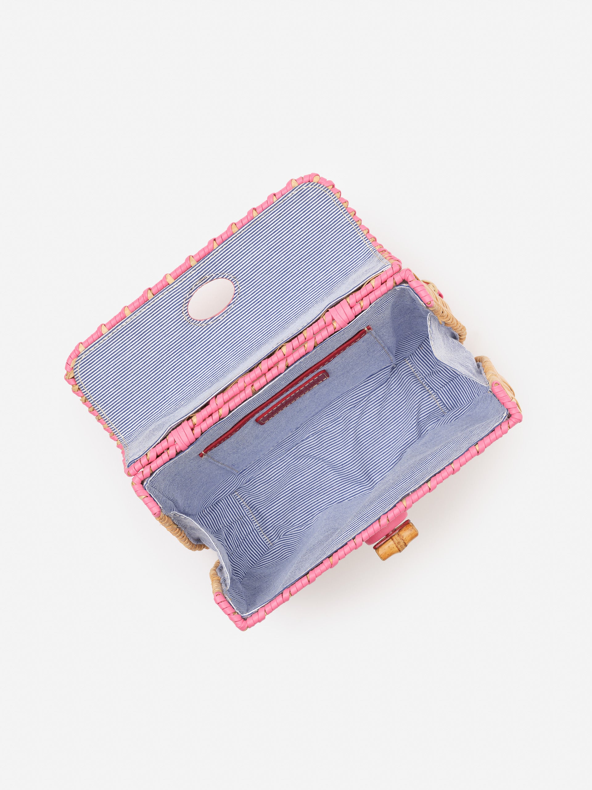 Open Waverly Wicker Handbag by J.McLaughlin showing striped fabric interior with a secure zipper pocket, combining effortlessly stylish design and enduring quality for a life well-lived.