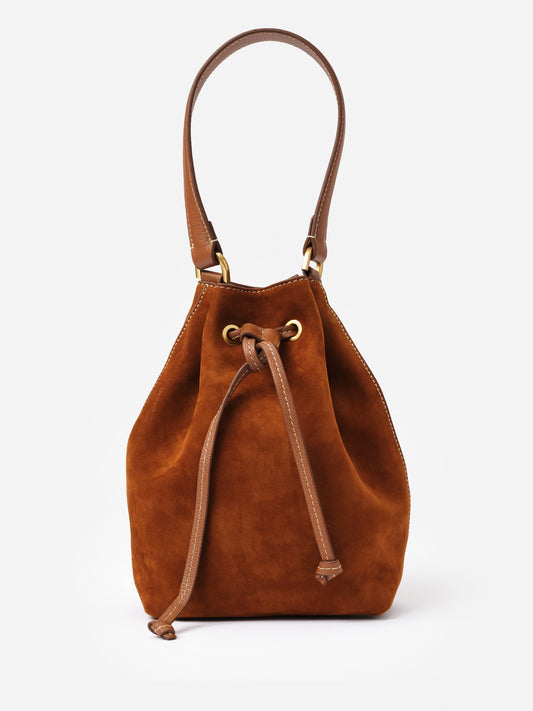 Newbury Suede Bucket Bag by J.McLaughlin in rich brown suede with a relaxed bucket shape, leather drawstring closure, and comfortable leather strap for timeless style.