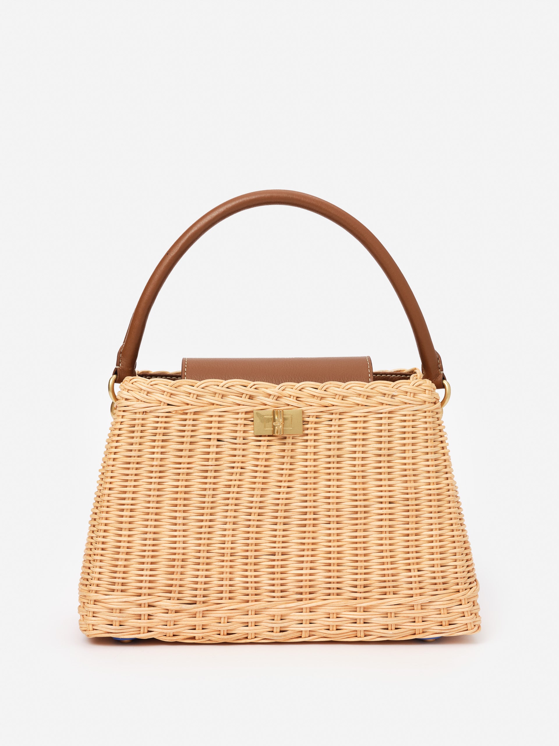 Faith Wicker Handbag by J.McLaughlin featuring a woven wicker body with a smooth brown leather handle and gold-tone clasp, blending effortlessly stylish design with enduring craftsmanship.