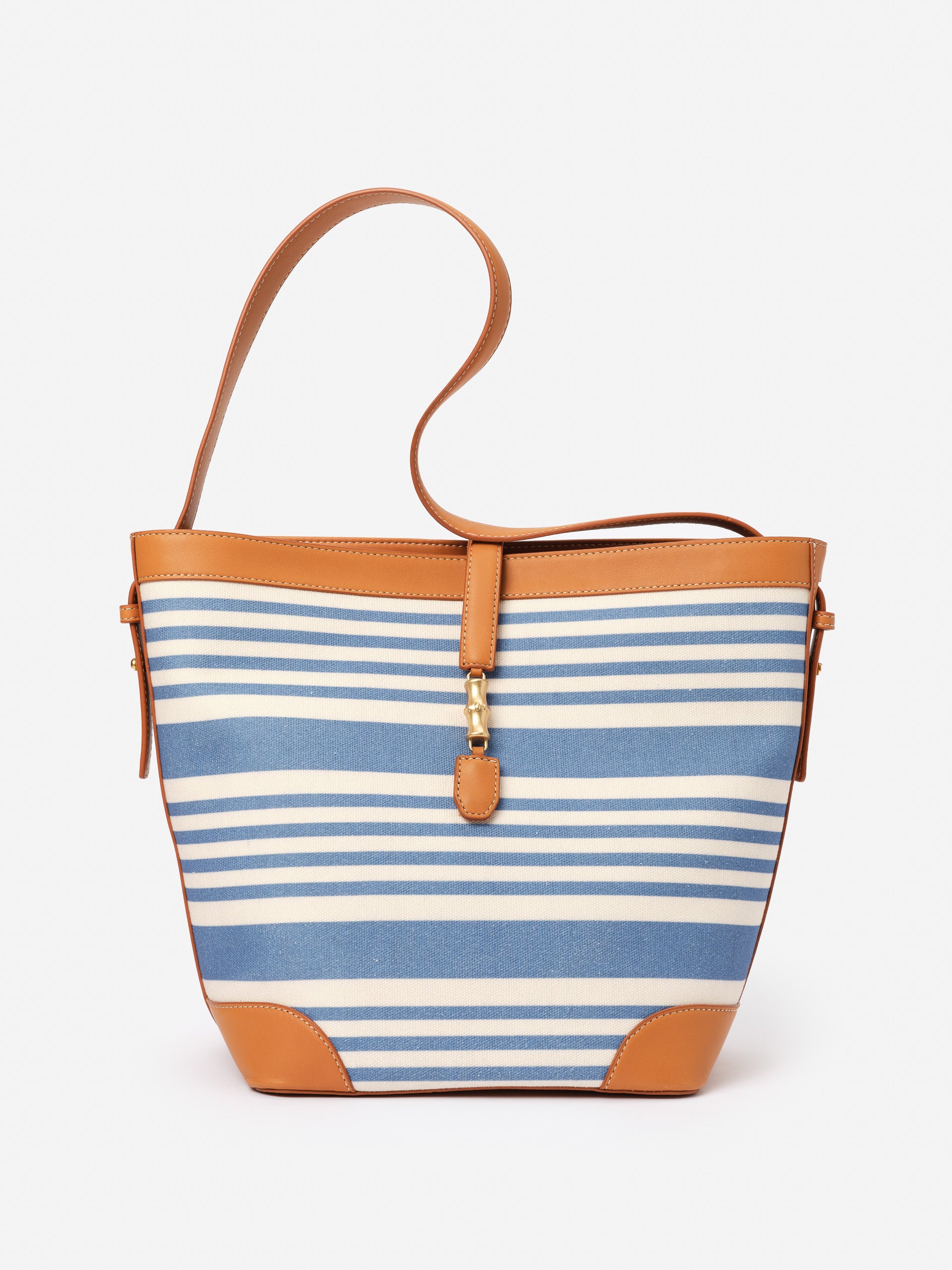 Crawford Handbag in Stripe by J.McLaughlin featuring blue and white stripes with tan leather trim, combining effortlessly stylish design and enduring craftsmanship for a life well-lived.