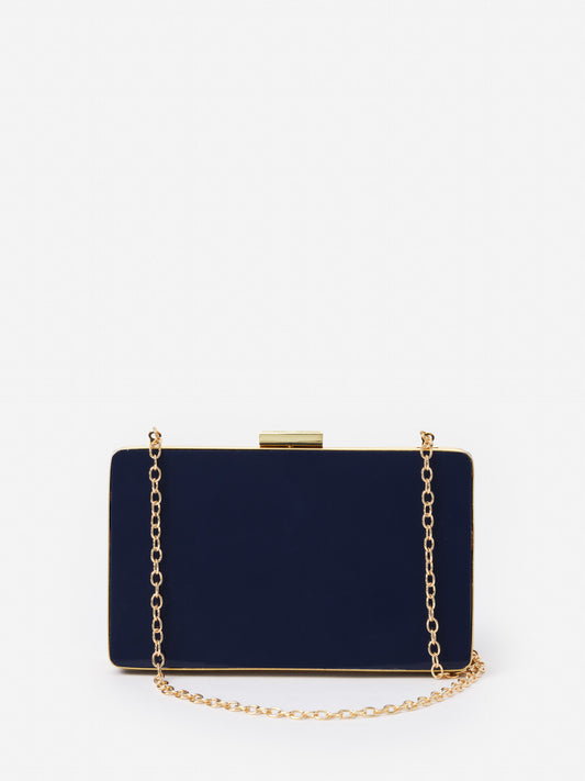 Audra Acrylic Clutch by J.McLaughlin features a sleek navy finish with a gold-tone chain, effortlessly stylish and crafted for enduring designs, a destination for defining style. Life, Well-Lived.