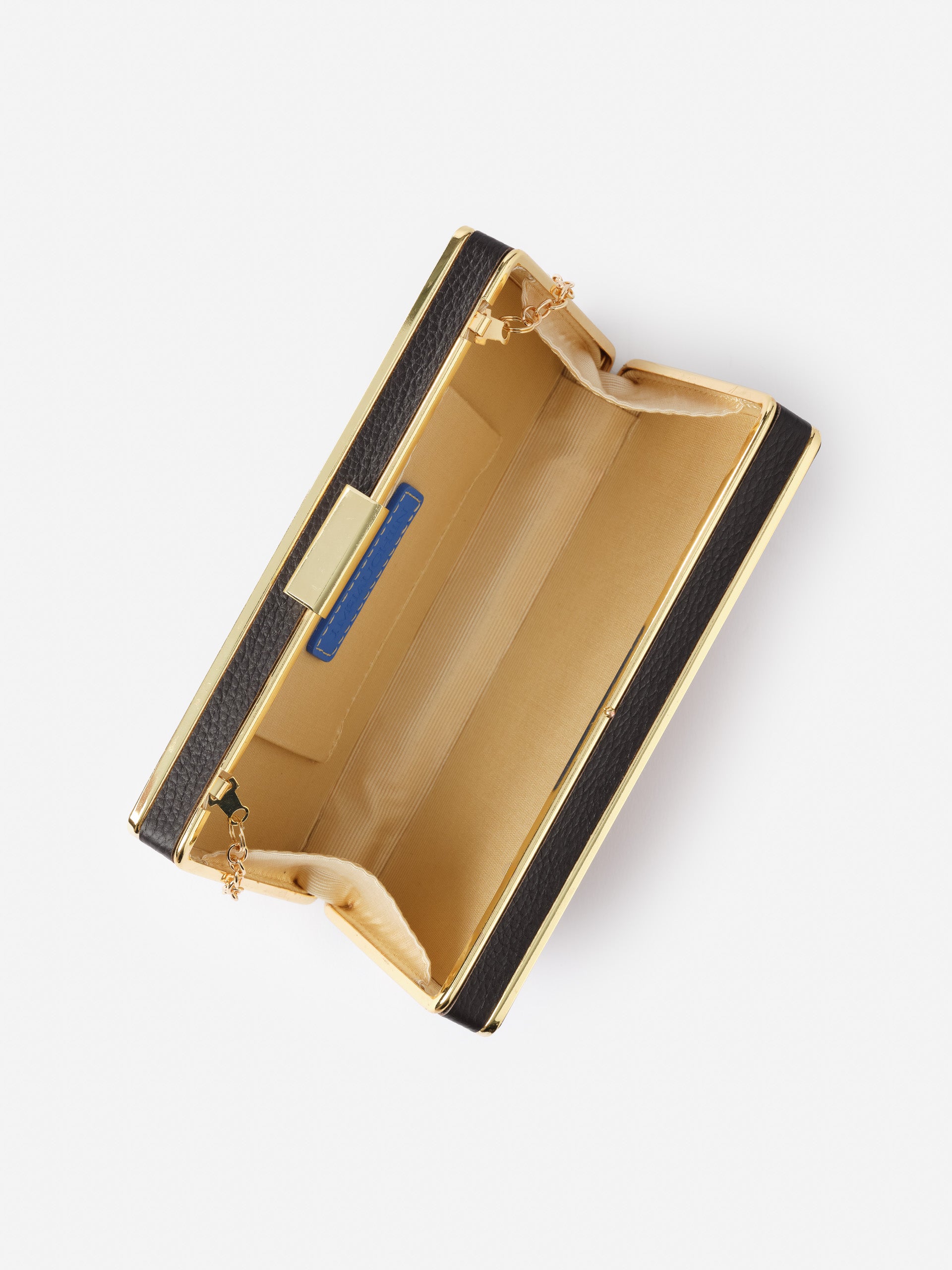 Interior view of the Audra Acrylic Clutch in Tortoise by J.McLaughlin, showcasing its sleek design with a gold-tone frame and beige lining, reflecting effortlessly stylish, enduring designs at a destination for defining style. Life, Well-Lived.