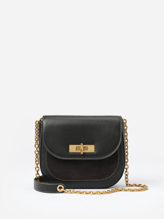 Waverly Leather Handbag by J.McLaughlin features a compact black leather design with mixed textures and a gold-tone chain strap, blending practical elegance and timeless style.