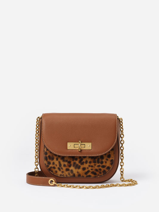 Waverly Leather Handbag in Leopard by J.McLaughlin features a compact silhouette with mixed textures, a gold chain strap, and timeless leopard print for effortlessly stylish looks.