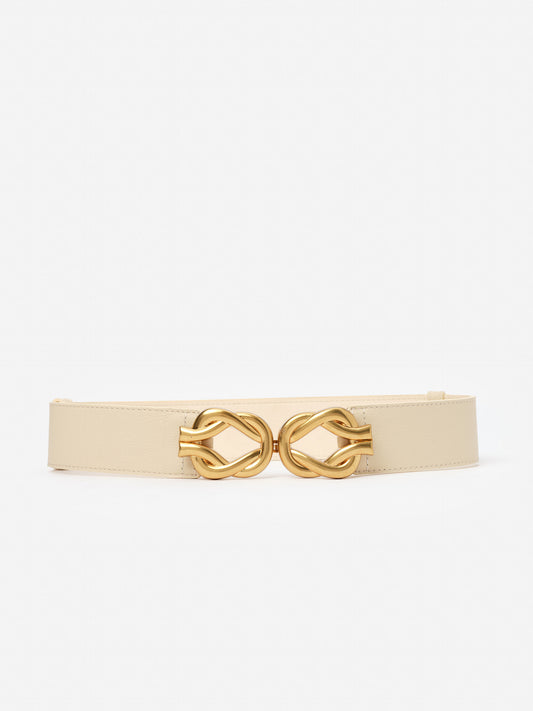 Eliza Belt by J.McLaughlin, featuring an effortlessly stylish beige strap and elegant gold buckle, exemplifies enduring designs in belts, crafted with innovative fabrics for a legacy of timeless fashion. A destination for defining style. Life, Well-Lived.