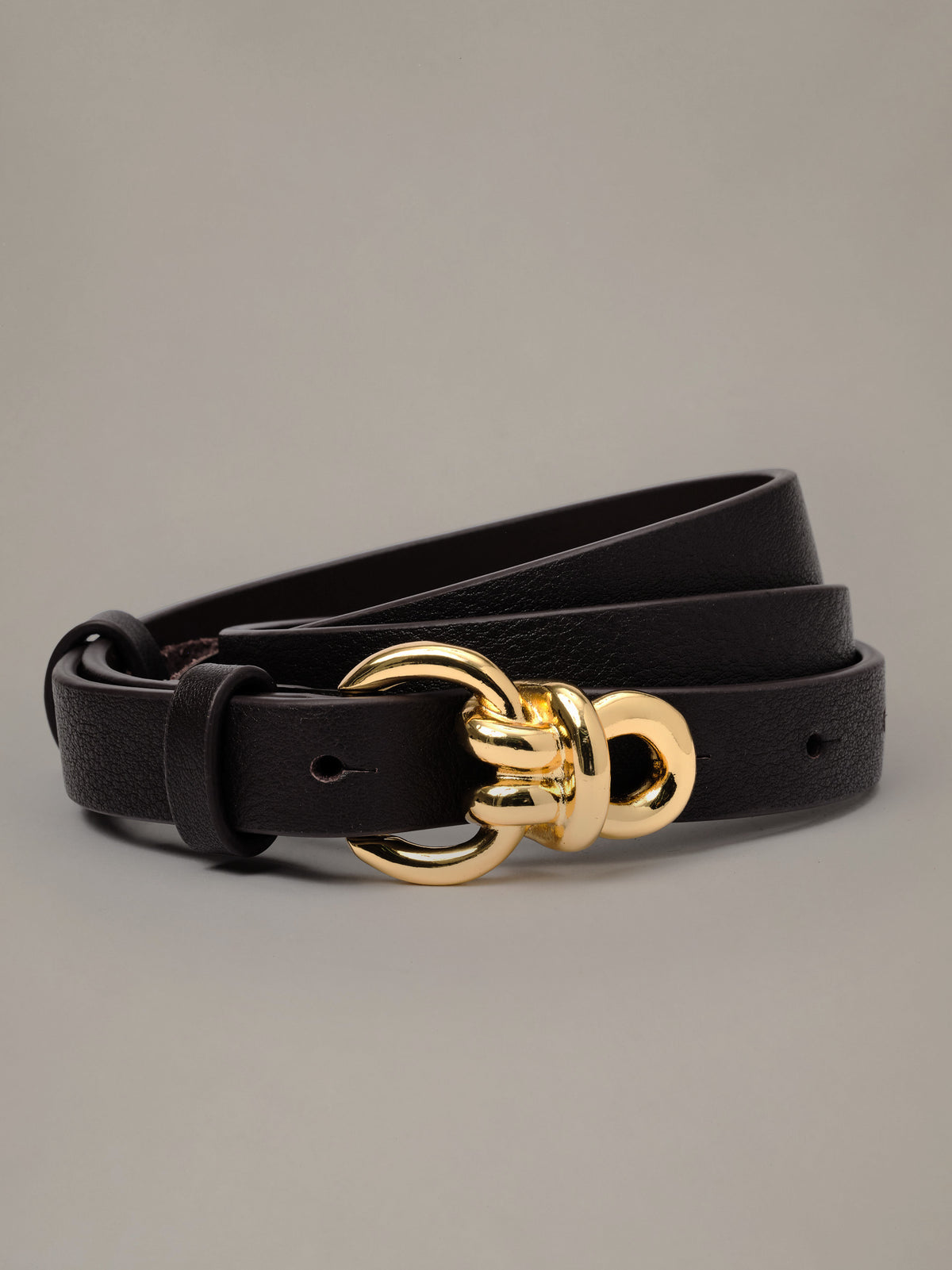 Natalie Leather Belt by J.McLaughlin in black leather with signature gold knot hardware and a slim profile