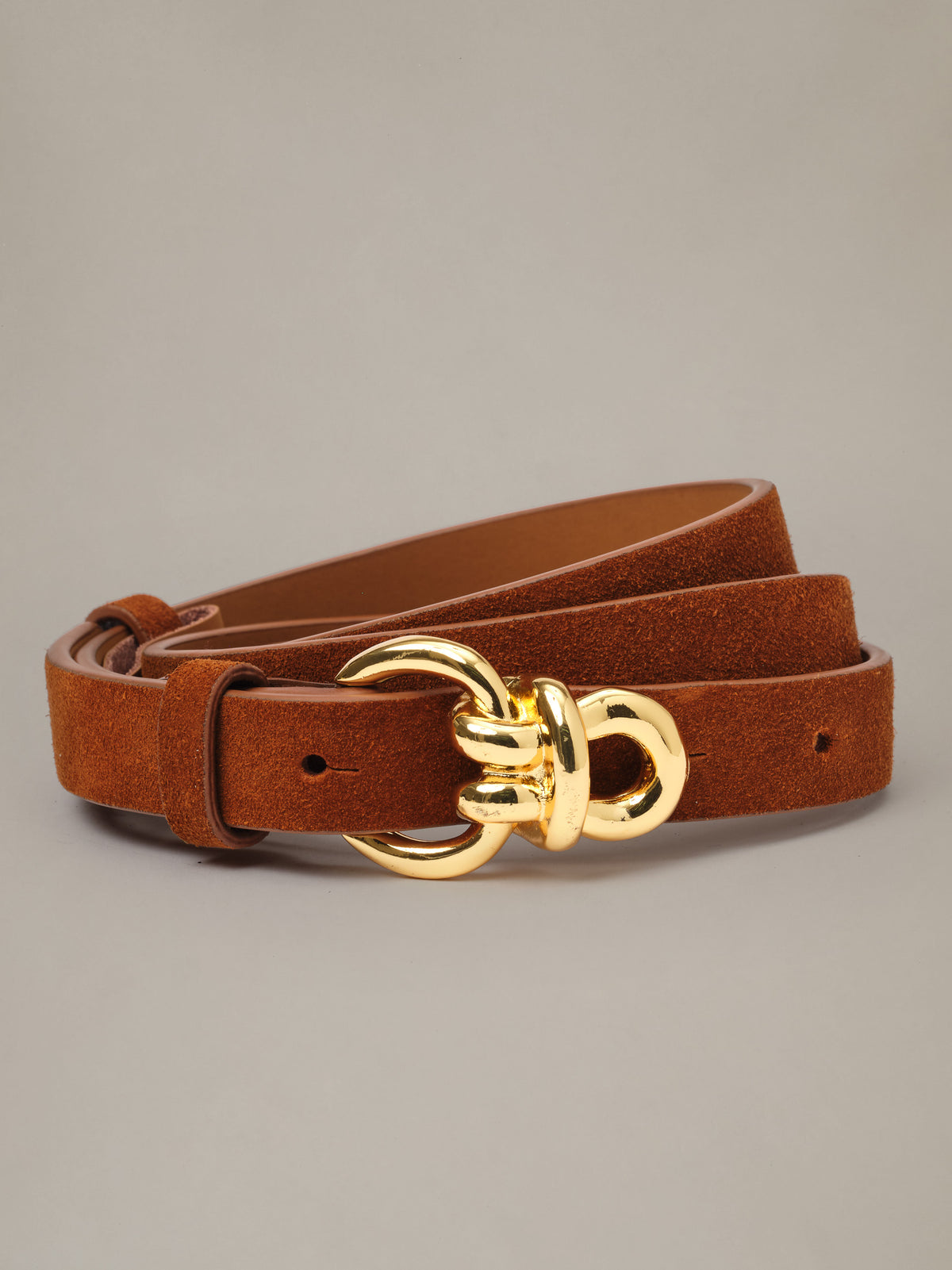 Natalie Suede Belt by J.McLaughlin in rich brown suede with a slim profile and distinctive gold knot hardware for timeless everyday style.