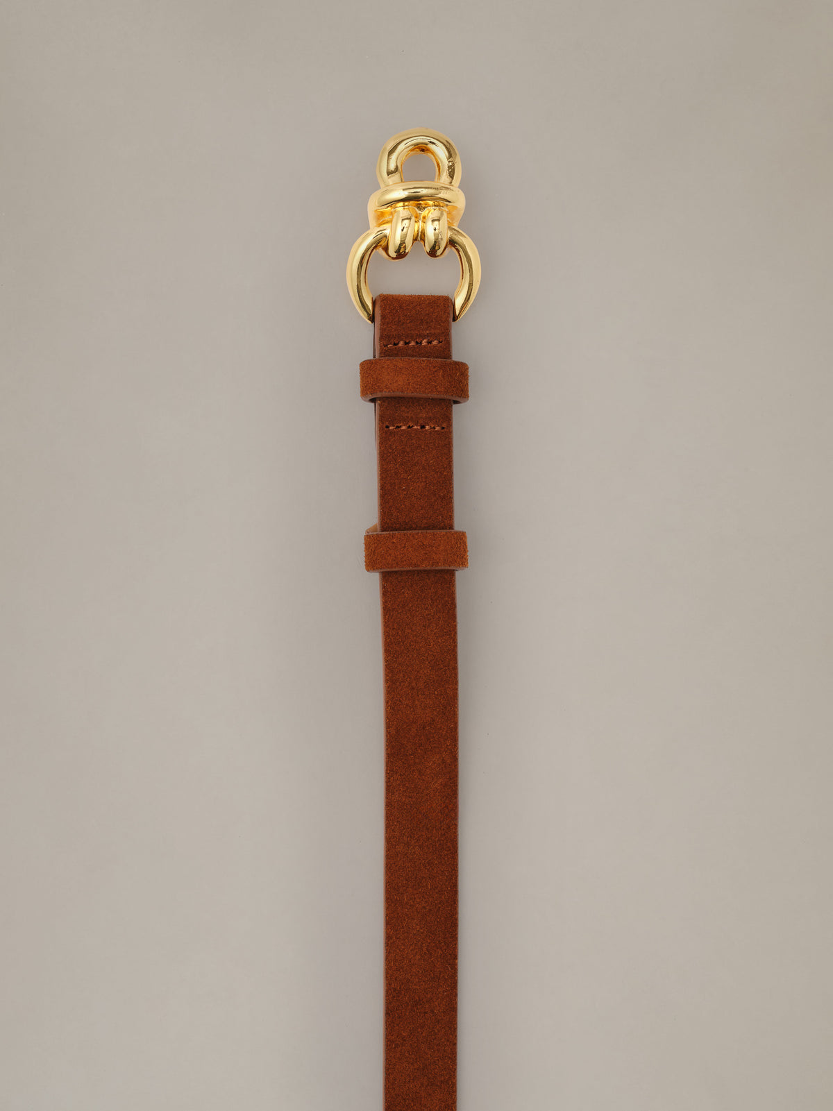 J.McLaughlin Natalie Suede Belt in brown suede with signature gold knot hardware and a slim profile