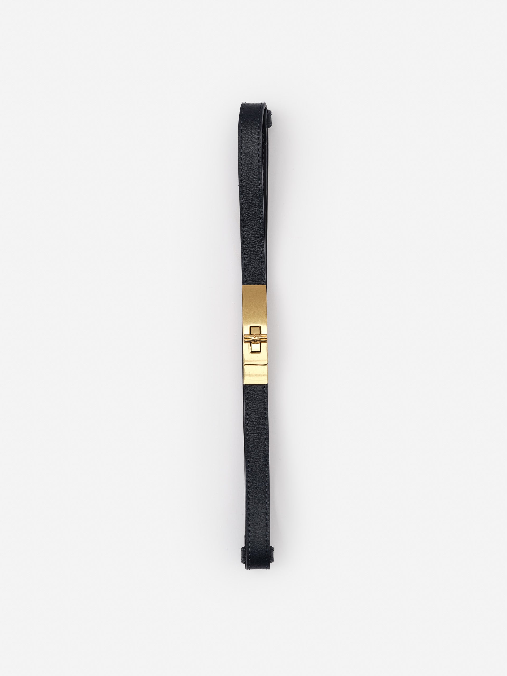 Liv Leather Belt by J.McLaughlin in black leather with a gold-tone clasp, showcasing effortlessly stylish, enduring designs and a legacy of timeless fashion.