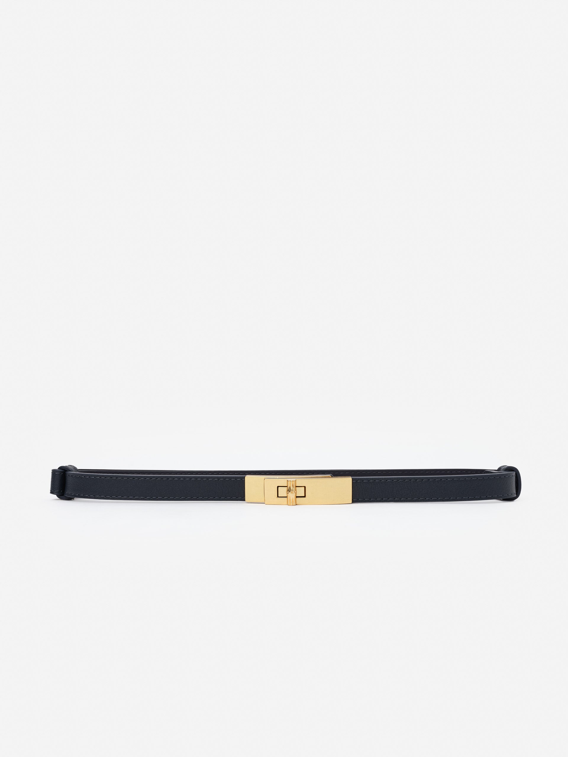 Liv Leather Belt by J.McLaughlin features an effortlessly stylish black leather design with a gold-tone clasp, embodying enduring designs and timeless fashion.