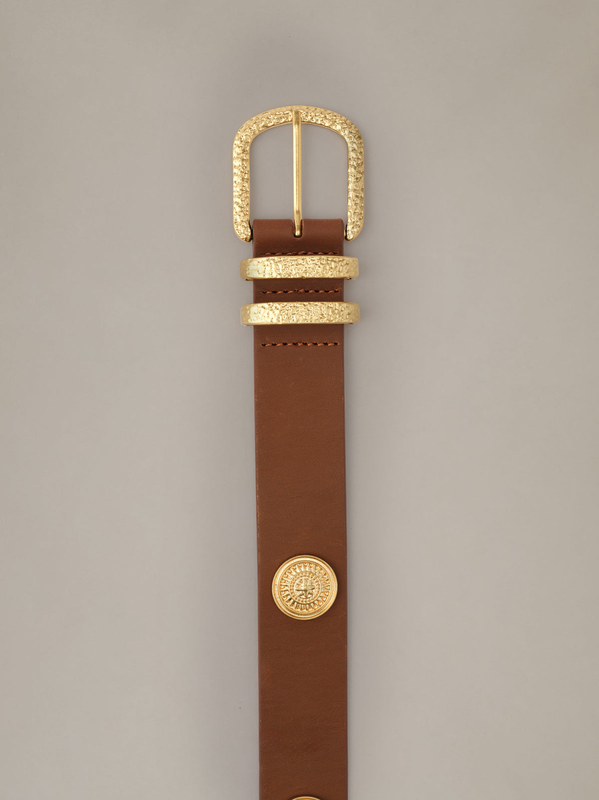 J.McLaughlin Kendall Leather Medalion Belt in brown leather with a textured gold buckle and decorative medallion detail on a neutral background