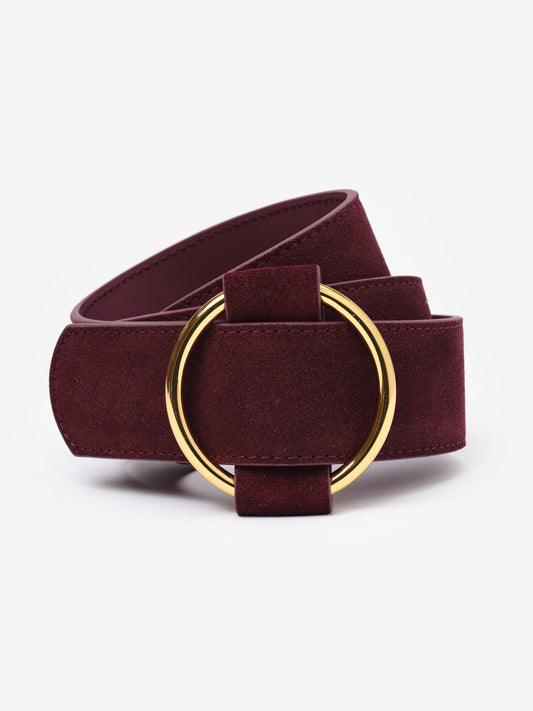 Amelia Suede Belt in deep burgundy with a smooth texture and gold circular buckle, showcasing J.McLaughlin’s classic, stylish craftsmanship for enduring appeal.