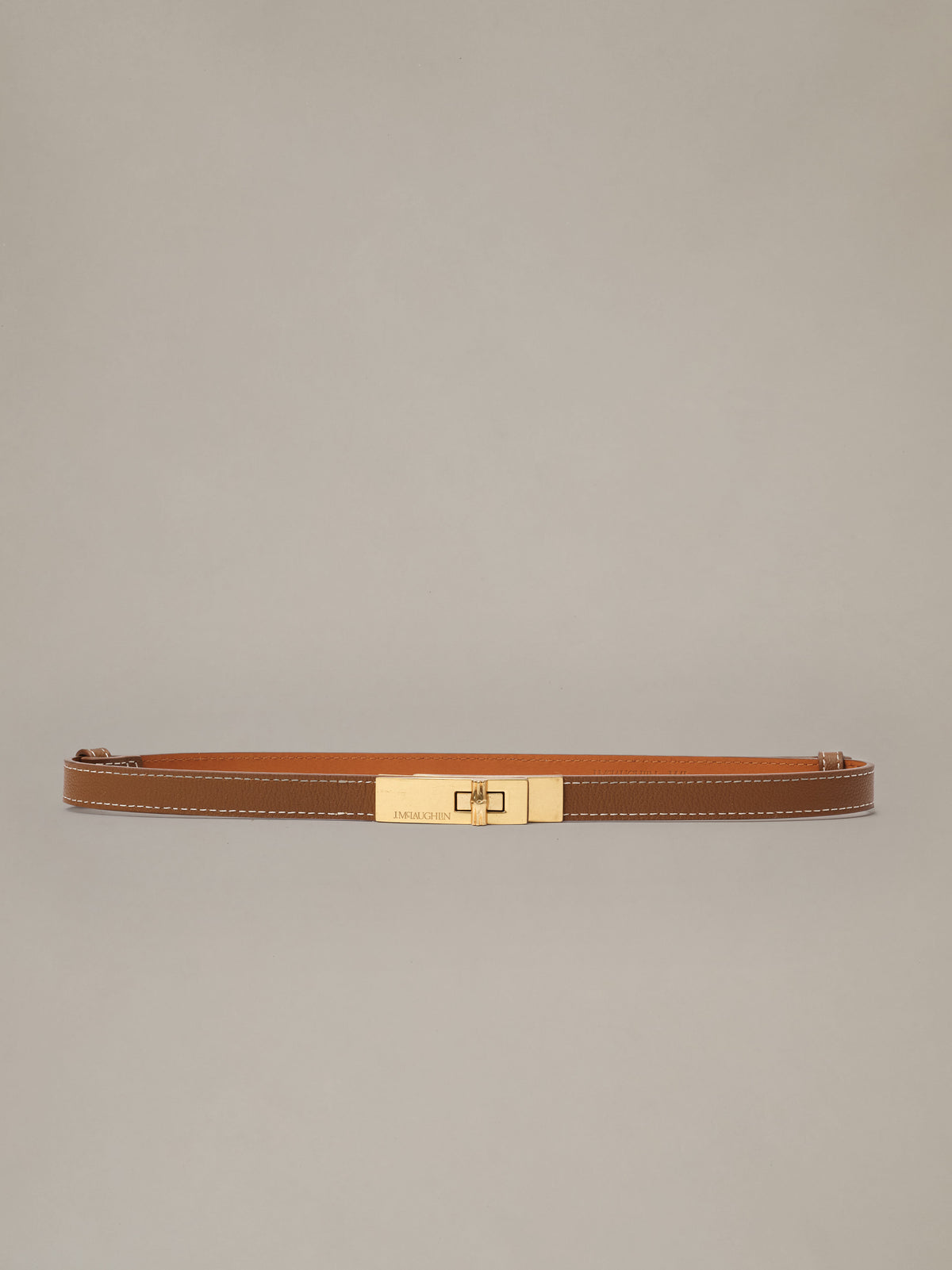 Liv Leather Belt by J.McLaughlin in brown pebble grain leather with a polished turn lock buckle for timeless style with jeans or dresses