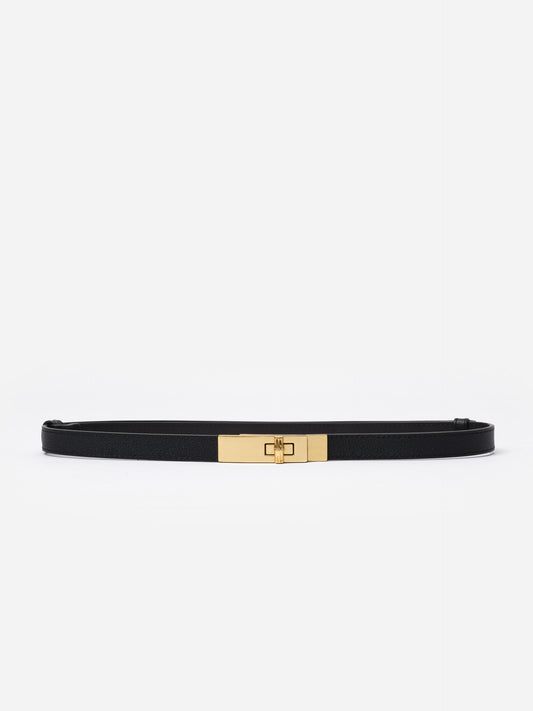 Liv Leather Belt by J.McLaughlin featuring a sleek black pebble grain leather strap and a polished gold turn-lock buckle, a stylish accessory for dresses and jeans.
