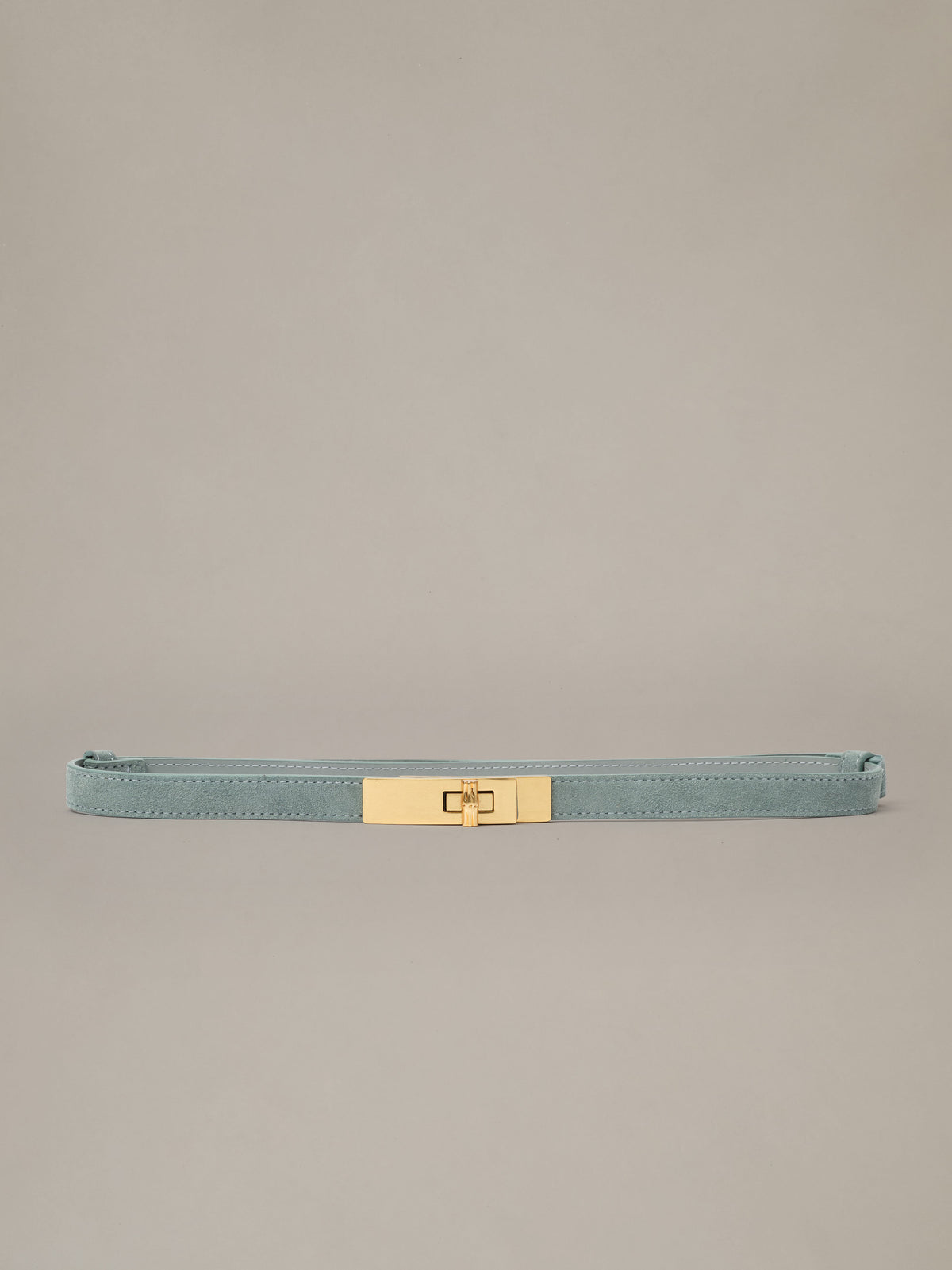 Liv Suede Belt by J.McLaughlin in soft blue suede with a polished gold turn-lock buckle. Timeless style for jeans and dresses.