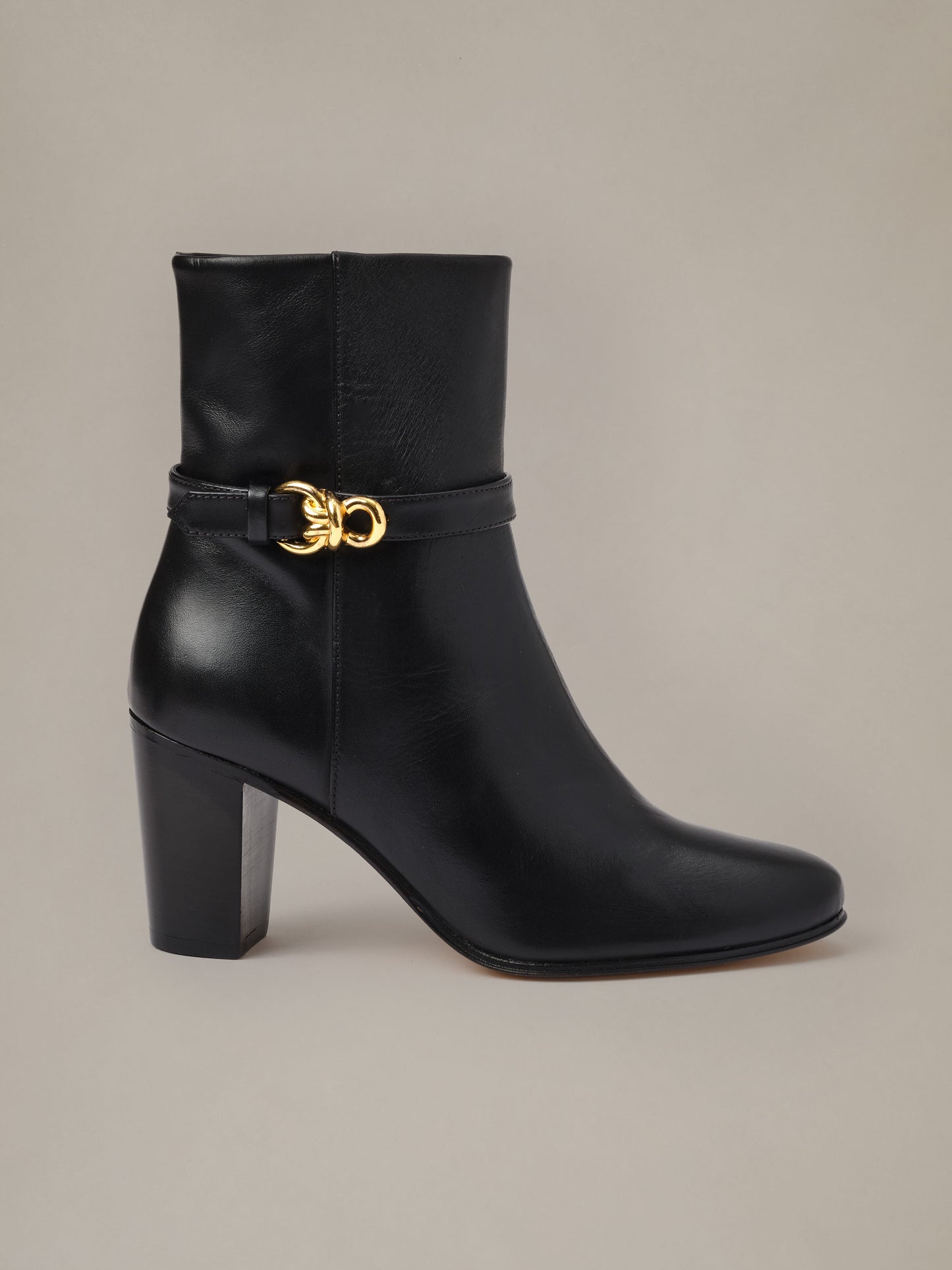 Elle Leather Ankle Boots by J.McLaughlin in black leather with a stacked heel and signature gold hardware