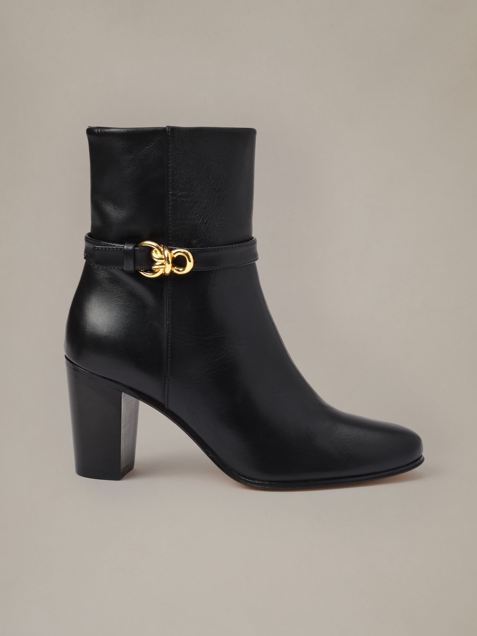 Elle Leather Ankle Boots by J.McLaughlin in black leather with a stacked heel and signature gold hardware