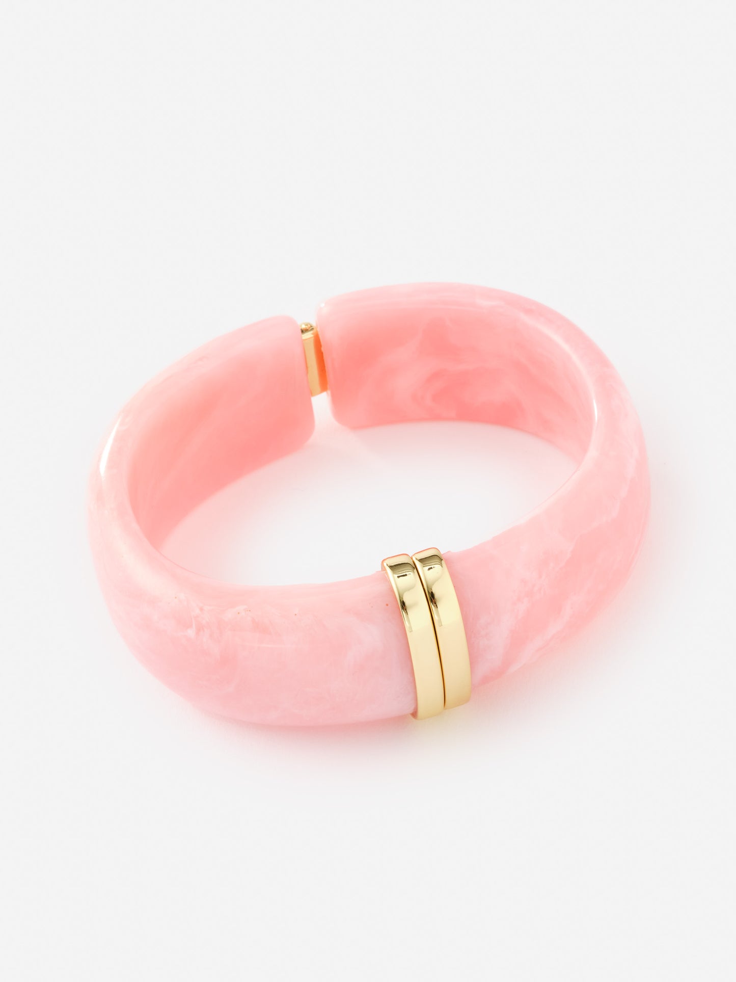 Resin Hinge Bangle in soft pink with gold-tone accents by J.McLaughlin, showcasing effortlessly stylish and enduring designs that define timeless fashion.