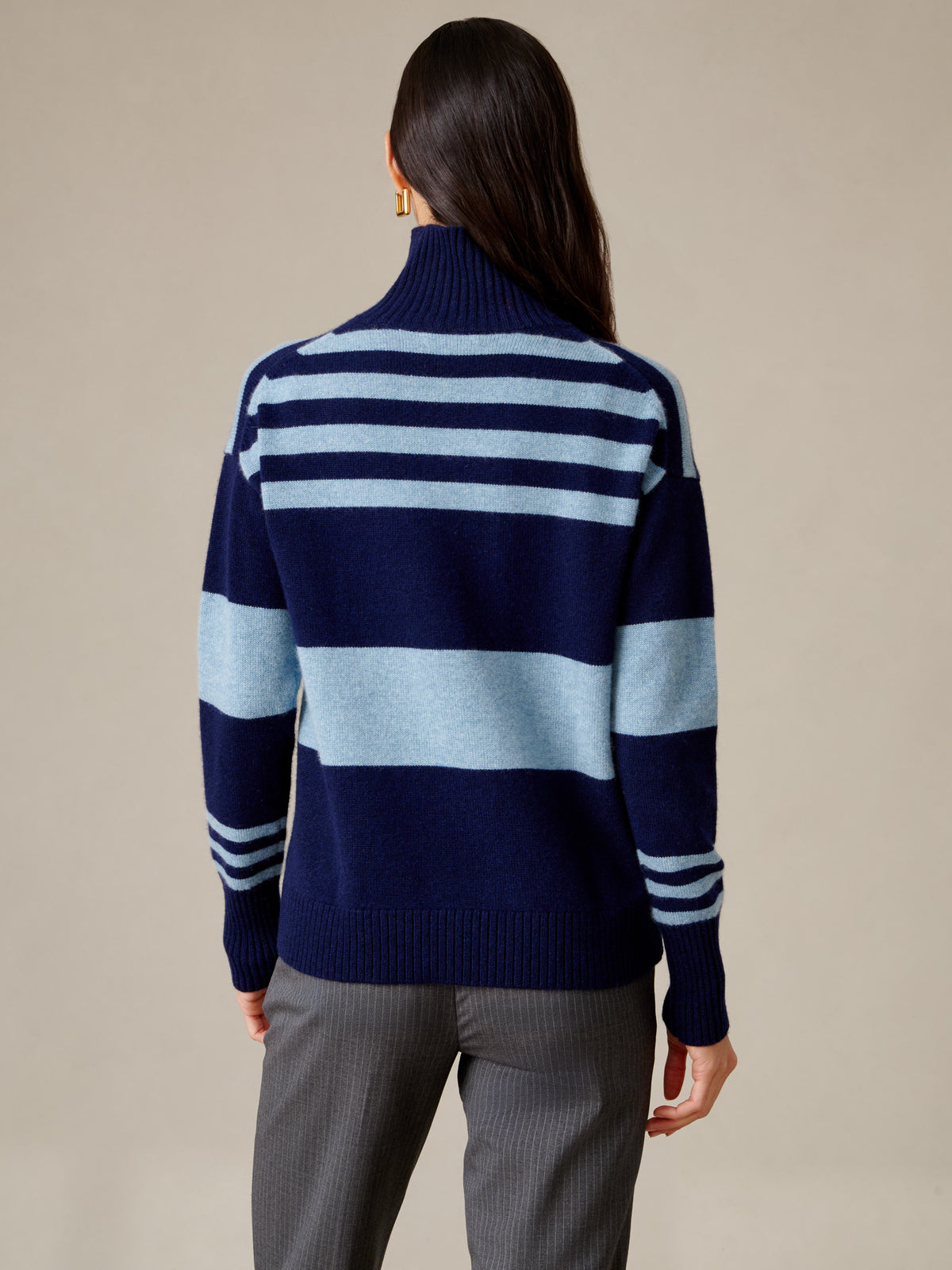 Dina Cashmere Turtleneck in Stripe by J.McLaughlin shown from the back on a model wearing a navy and pale blue striped cashmere sweater