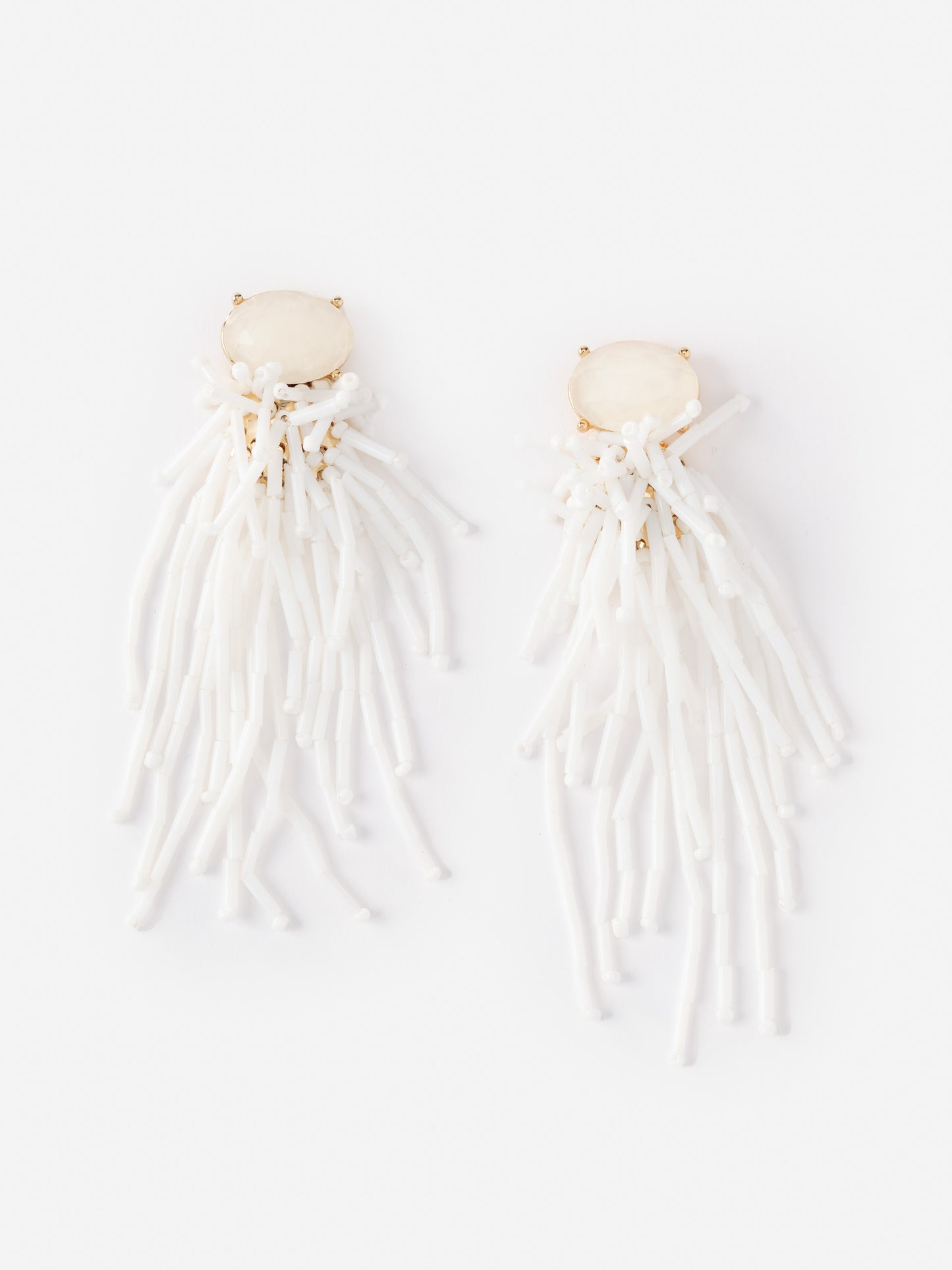 Beaded Tassel Earrings from J.McLaughlin feature white bead strands cascading from a smooth oval stone, embodying effortlessly stylish, enduring designs for a legacy of timeless fashion.
