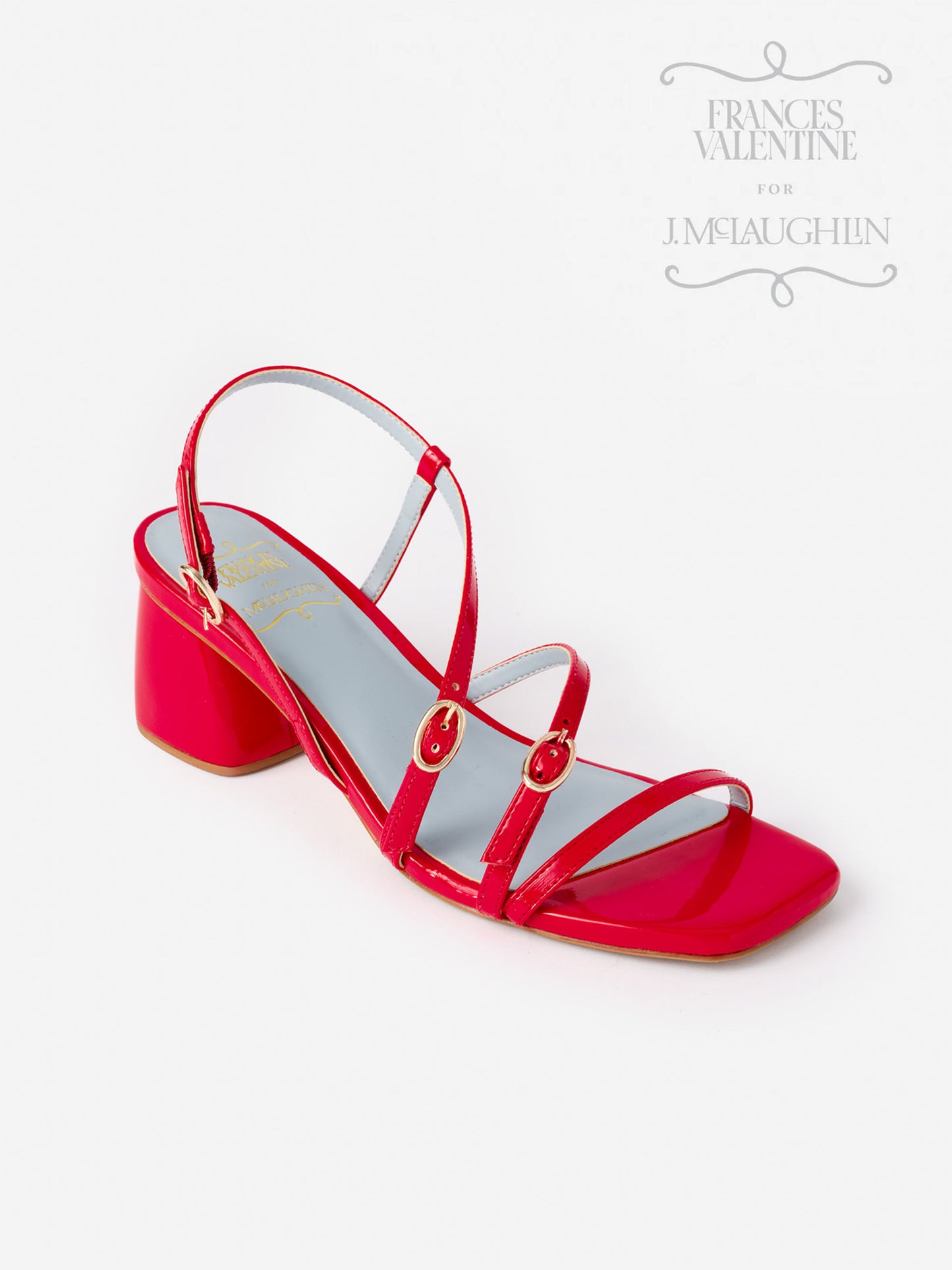 Red Lexi Heels by J.McLaughlin featuring glossy straps with gold buckle accents and a block heel, showcasing effortlessly stylish, enduring designs and innovative fabrics.