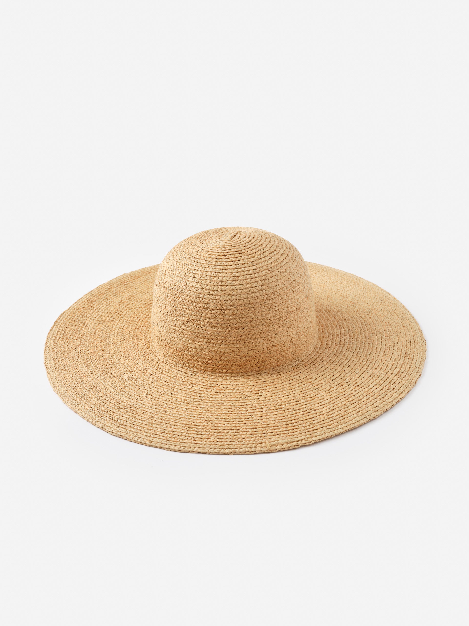 Odette Raffia Hat by J.McLaughlin, a natural woven design combining innovative fabrics with timeless craftsmanship, embodying effortlessly stylish, enduring designs.