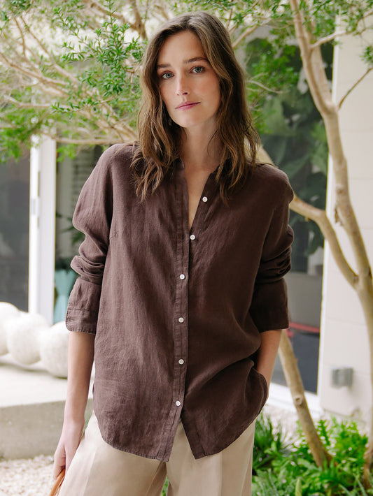 Model wearing J.McLaughlin Britt shirt in dark brown made with linen.