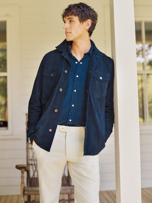 Model wearing J.McLaughlin Suede overshirt in navy made with suede.