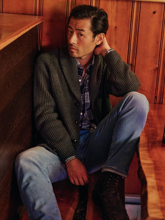 Model wearing J.McLaughlin Roy sweater in charcoal made with lambswool.