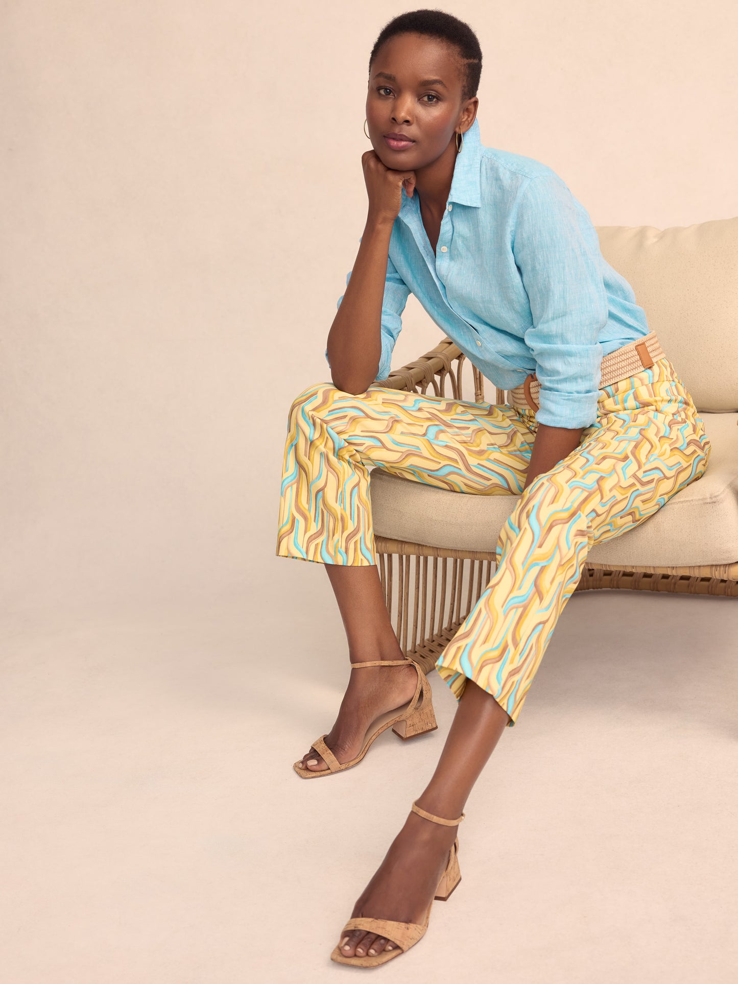 Model wearing J.McLaughlin Ivy pants in yellow/multi made with Amelia cloth.