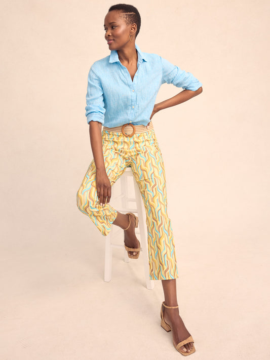 Model wearing J.McLaughlin Ivy pants in yellow/multi made with Amelia cloth.