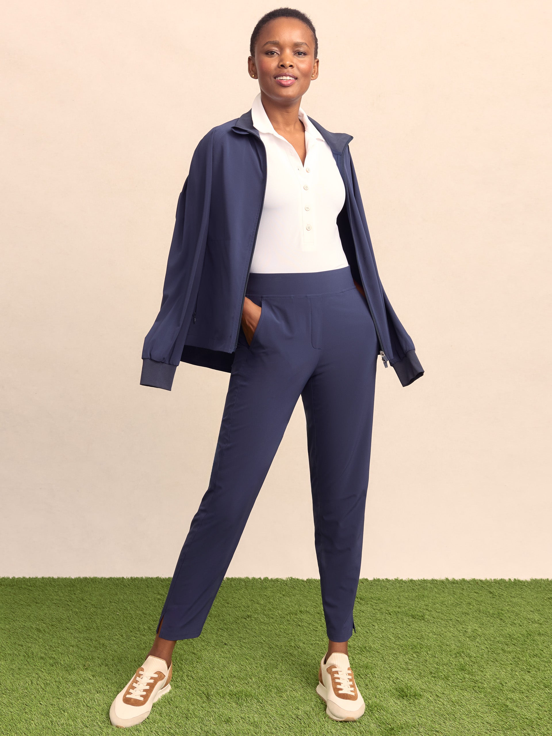 Model wearing J.McLaughlin Beasley pants in navy made with polyester/spandex.