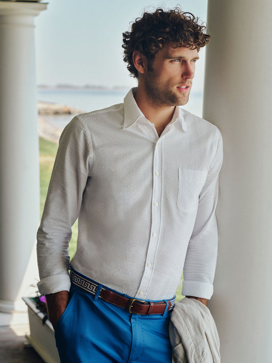 Man wearing a Belvedere Cotton Seersucker Shirt by J. McLaughlin, showcasing effortlessly stylish, enduring designs with innovative fabrics and classic craftsmanship.