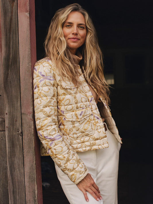 Laurel Puffer in Mini Heraldic Tassel by J.McLaughlin worn by a woman showing its quilted design cord trim and versatile sophisticated style