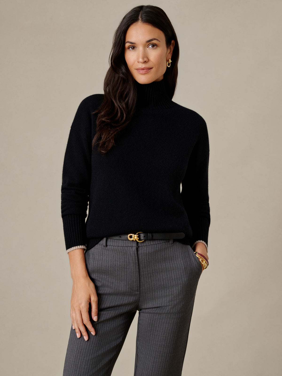 Dina Cashmere Turtleneck by J.McLaughlin in black cashmere styled with gray pants for timeless polished style