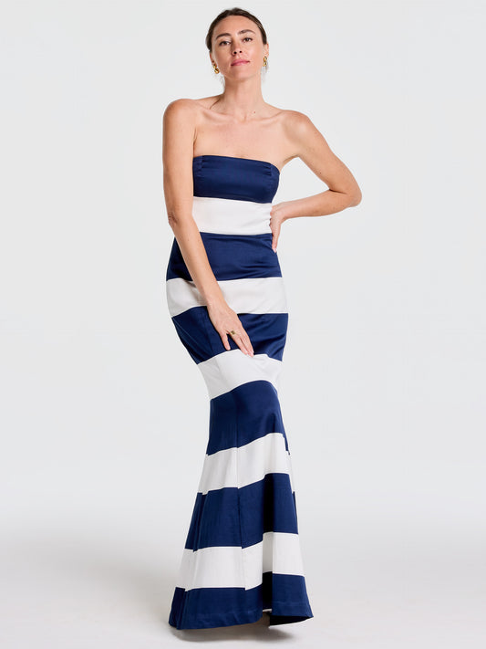 Woman modeling a strapless Ashley Dress in Mega Mariner Stripe by J.McLaughlin, featuring effortlessly stylish, enduring designs with a legacy of timeless fashion. A destination for defining style. Life, Well-Lived.