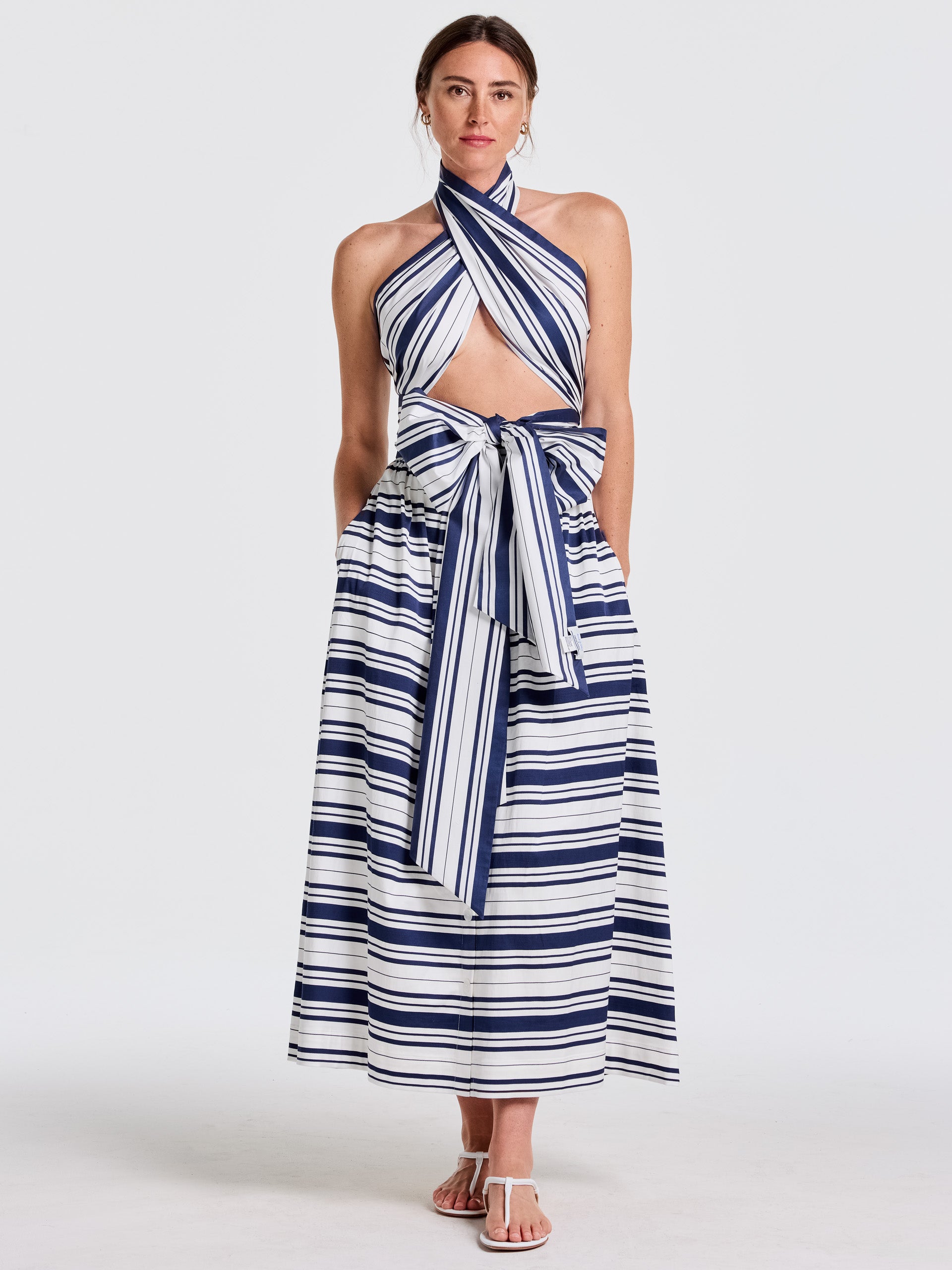 Woman wearing a stylish Mariner Stripe outfit featuring the Donna Scarf in Mariner Stripe by J.McLaughlin, showcasing effortlessly stylish, enduring designs and innovative fabrics for a legacy of timeless fashion. A destination for defining style. Life, Well-Lived.
