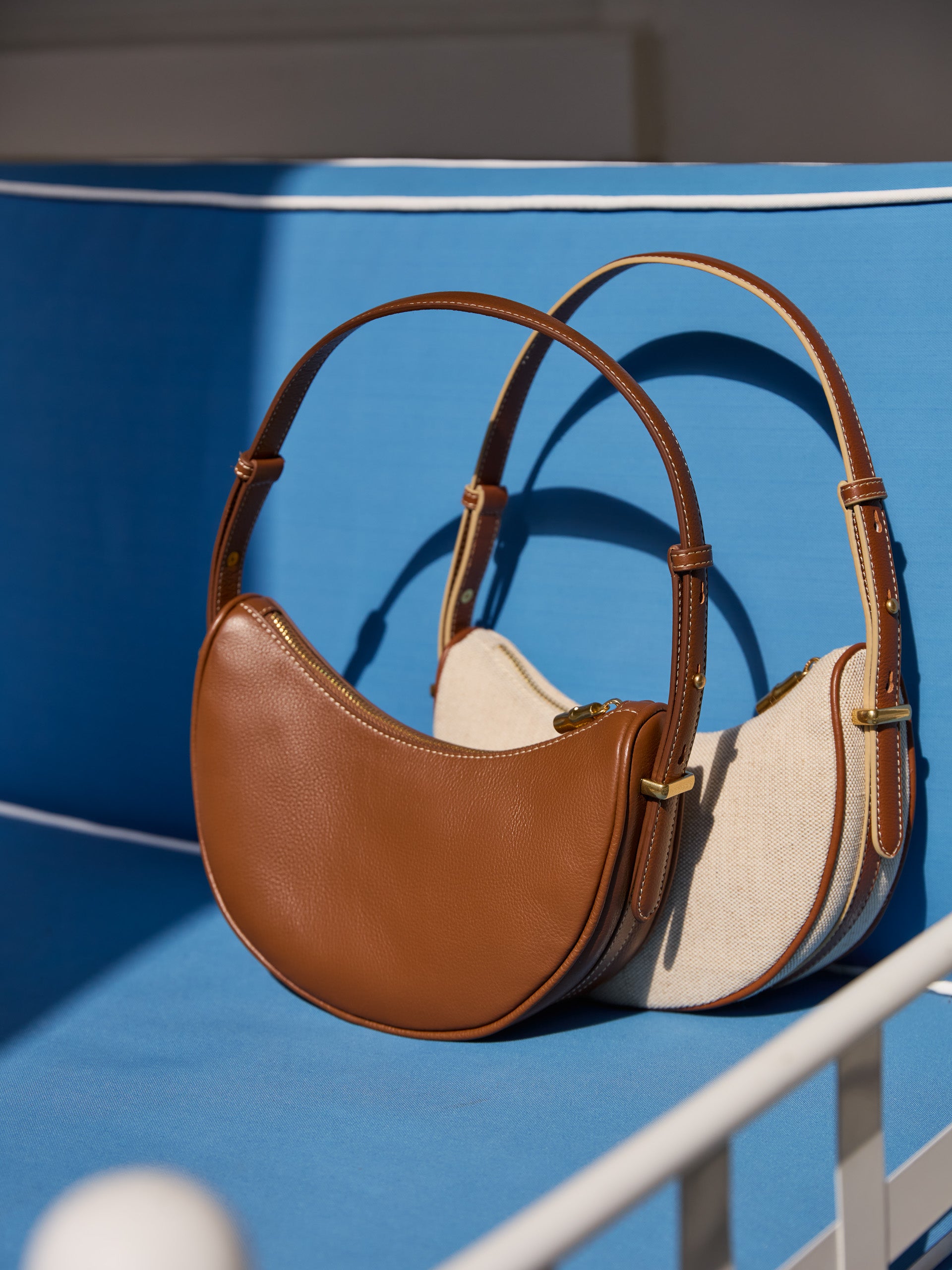 J.McLauhglin Mezzaluna handbag in tobacco made with leather. 