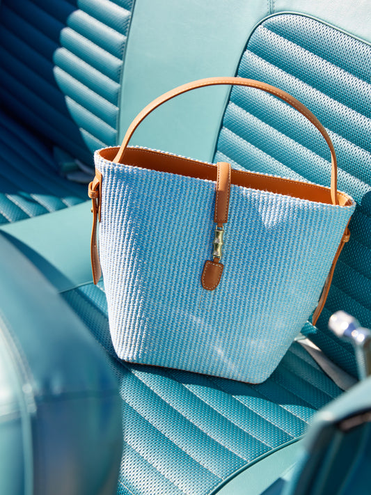 J.McLaughlin Crawford handbag in blue made with leather and raffia.