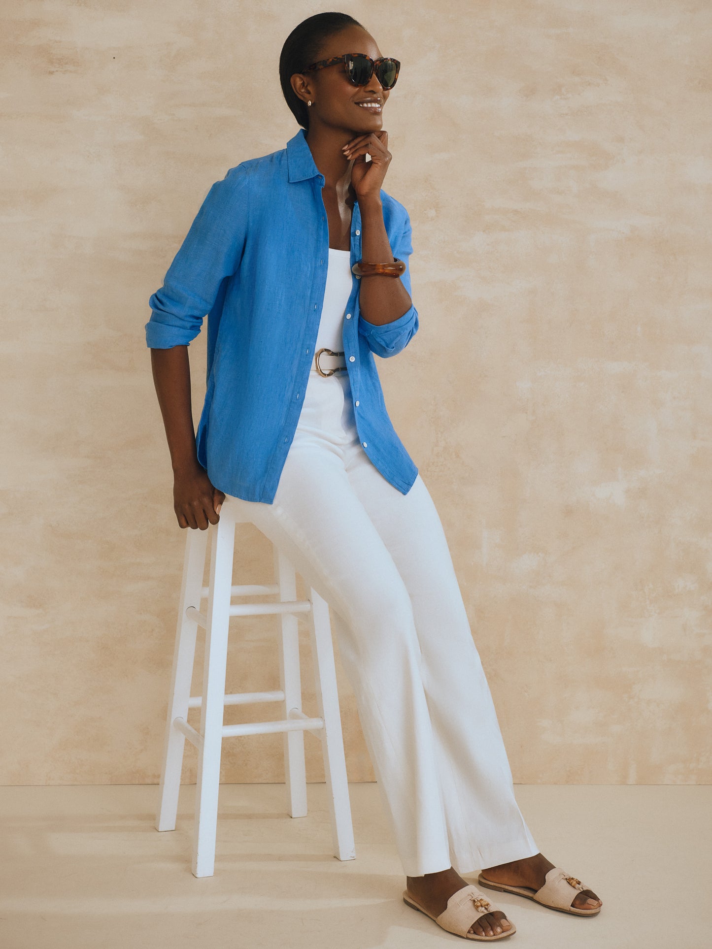 Model wearing J.McLaughlin Britt shirt in french blue made with linen.