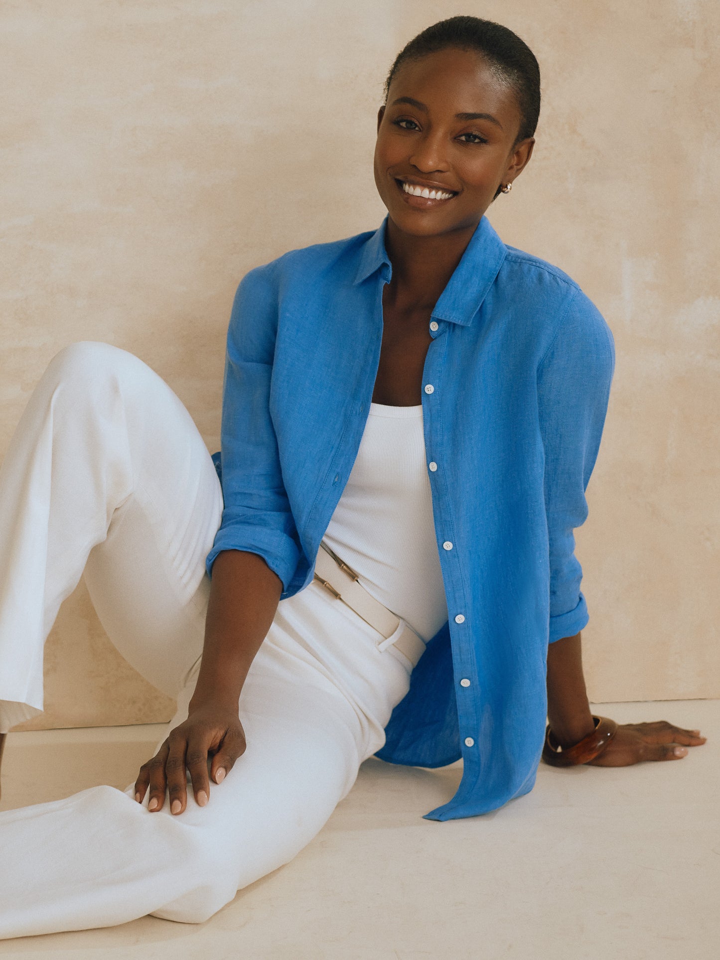 Model wearing J.McLaughlin Britt shirt in french blue made with linen.