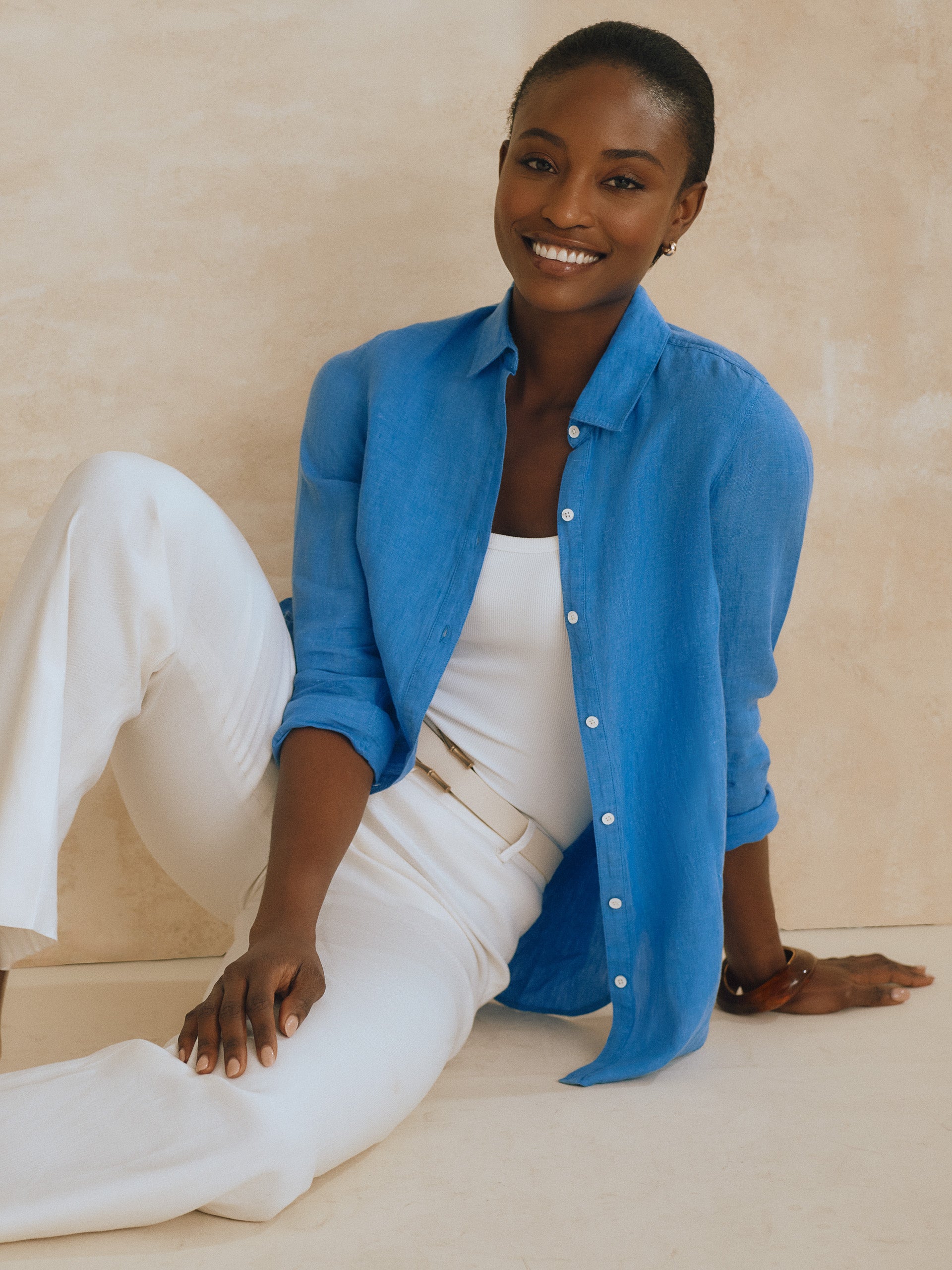 Model wearing J.McLaughlin Britt shirt in french blue made with linen.