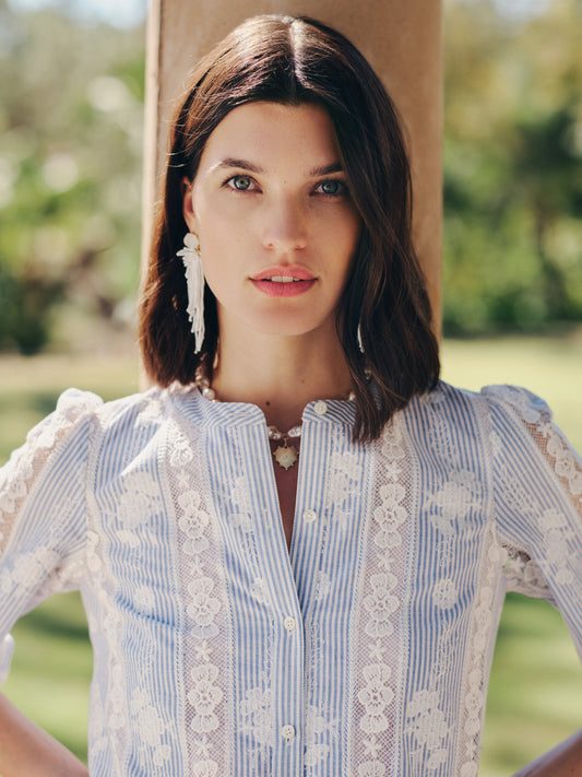 Close-up of a woman wearing the Alice Blouse in Stripe by J.McLaughlin, featuring delicate lace details and stripes, embodying effortlessly stylish, enduring designs and innovative fabrics. A destination for defining style. Life, Well-Lived.