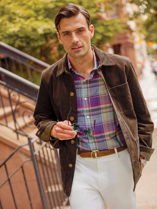 Model wearing J.McLaughlin Weekender jacket in brown made with corduroy.